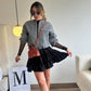 Short skirt in light black bolero fabric